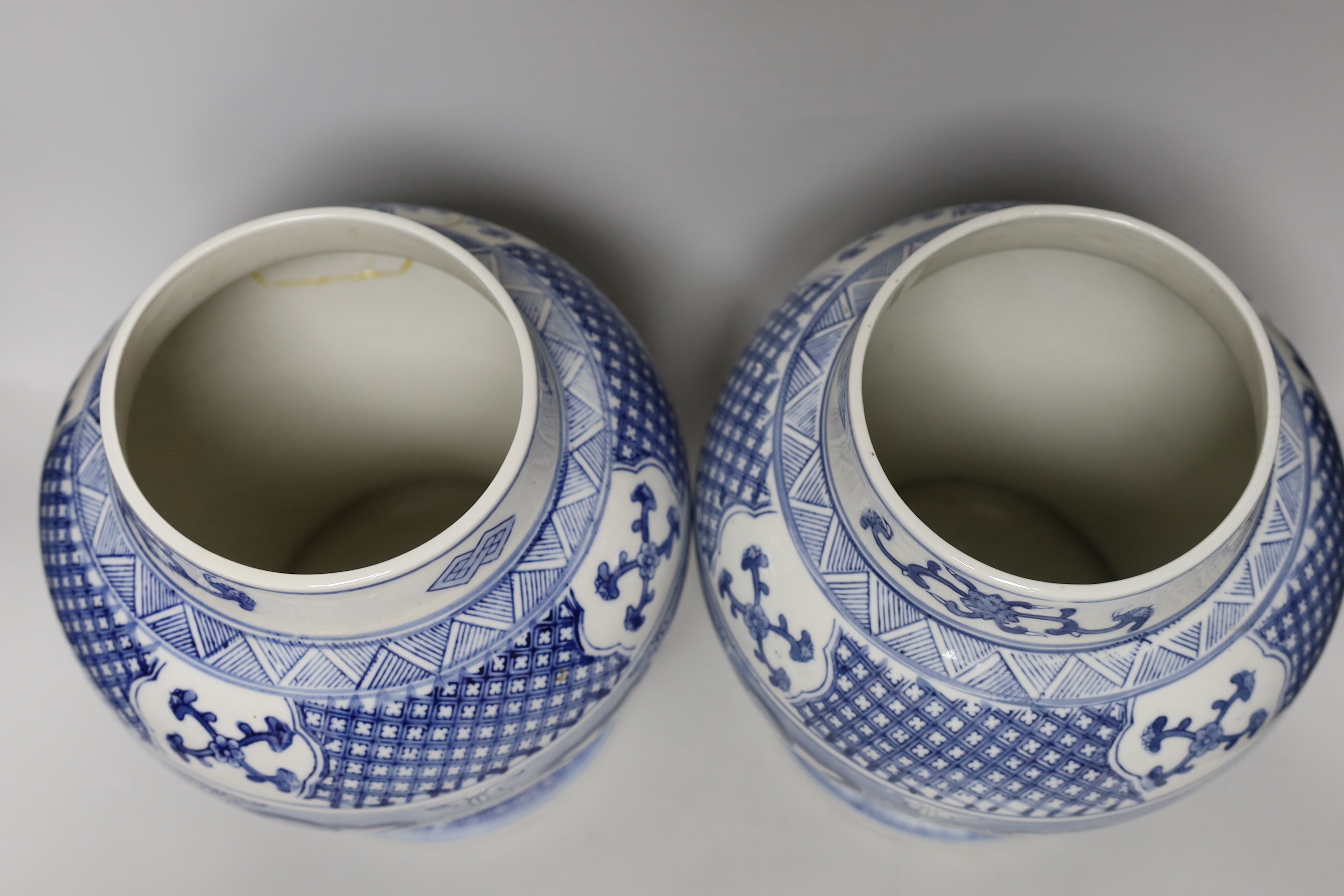 A pair of Chinese blue and white baluster vases and covers, 45cm high